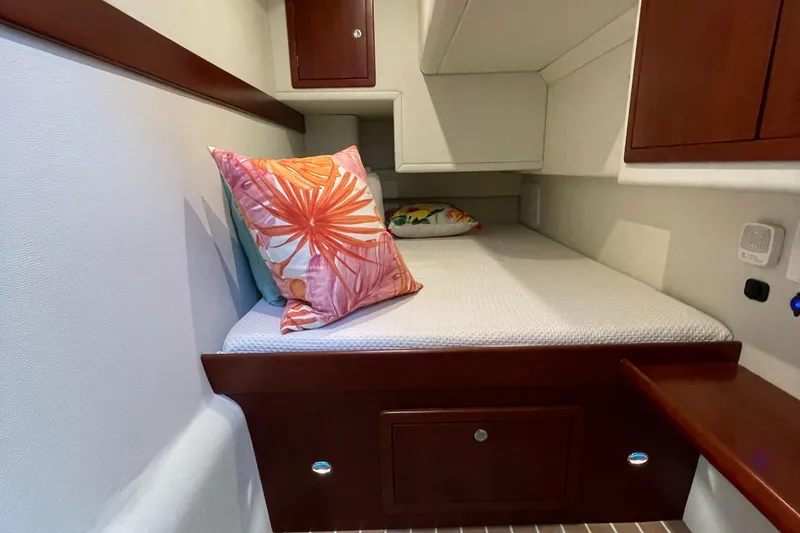 Slide: The Image of Cozy cabin interior of 2025 ArrowCat 420 Coupe with vibrant decorative pillows. - 8