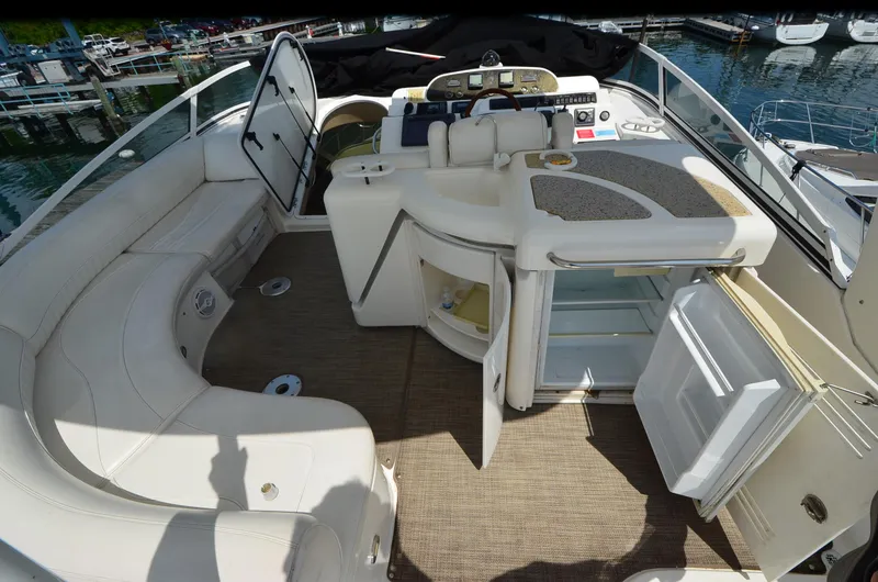 Slide: The Image of 2003 Cruisers Yachts 5000 Sedan Sport interior with seating and open storage compartments. - 10