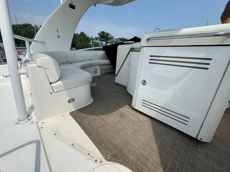 Slide: The Image of 2003 Cruisers Yachts 5000 Sedan Sport interior with seating and cabinetry. - 12