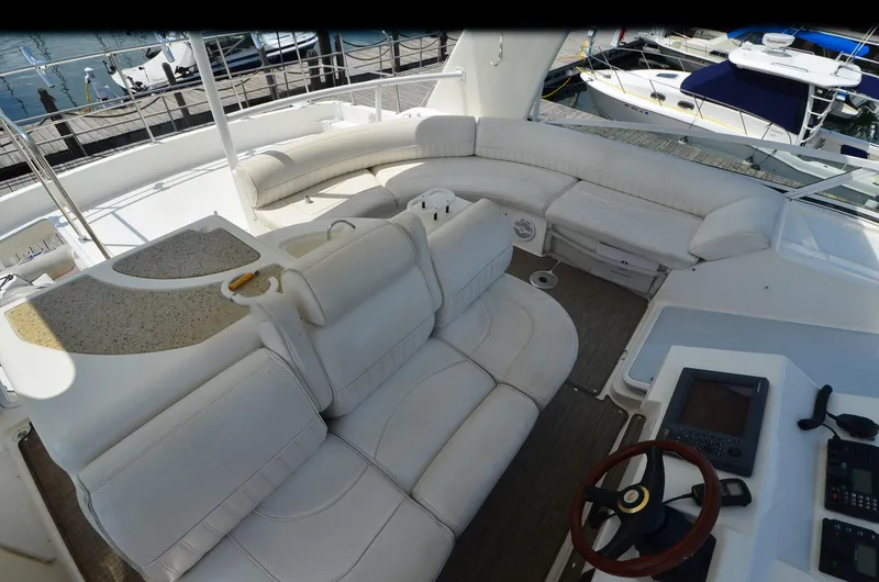 Slide: The Image of Luxurious 2003 Cruisers Yachts 5000 Sedan Sport interior with plush seating and modern controls. - 22
