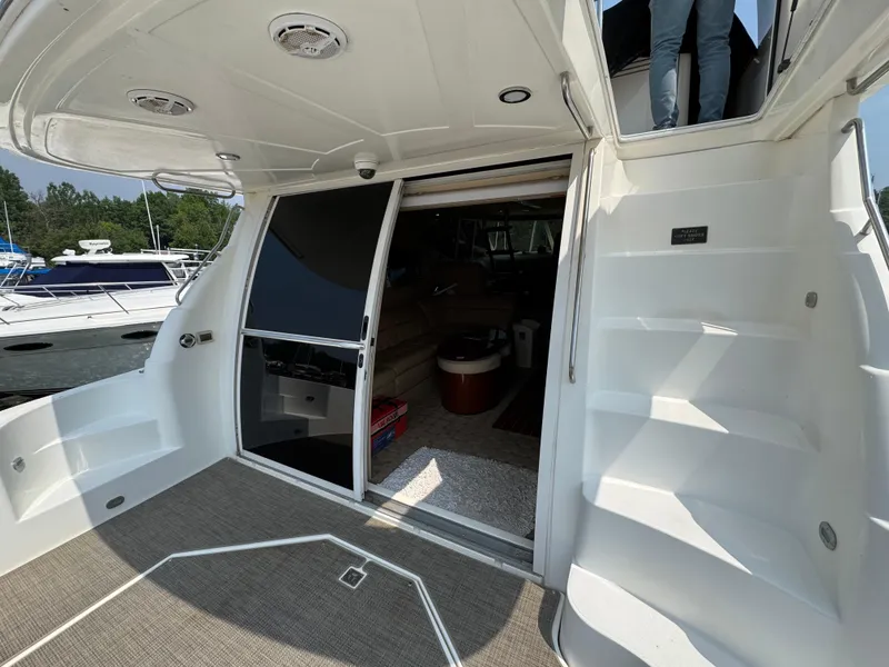 Slide: The Image of 2003 Cruisers Yachts 5000 Sedan Sport interior view with open sliding door and staircase. - 27