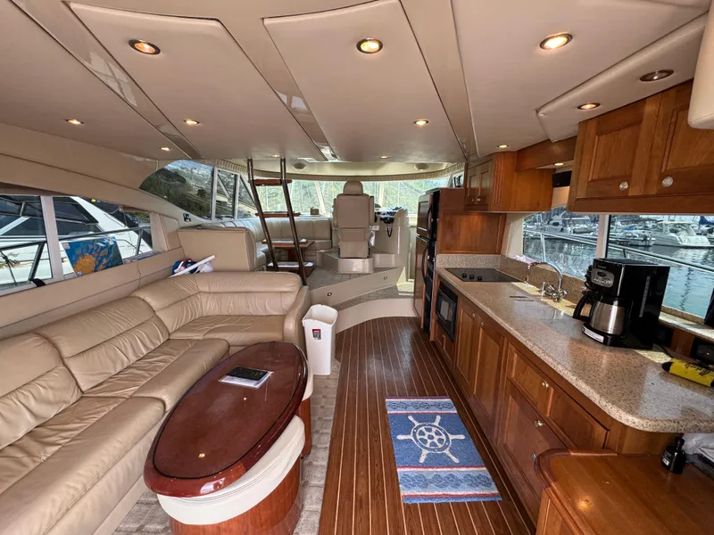 Slide: The Image of Luxurious interior of 2003 Cruisers Yachts 5000 Sedan Sport with leather seating and modern kitchen. - 32