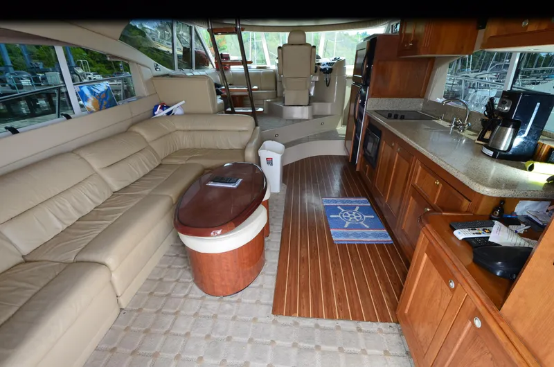 Slide: The Image of Luxurious interior of 2003 Cruisers Yachts 5000 Sedan Sport with leather seating and modern kitchen. - 33