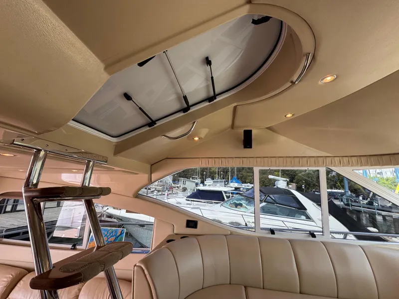 Slide: The Image of Interior of 2003 Cruisers Yachts 5000 Sedan Sport with skylight and marina view. - 41