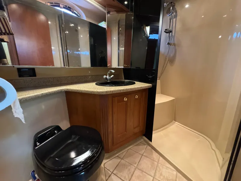 Slide: The Image of Luxurious bathroom in 2003 Cruisers Yachts 5000 Sedan Sport with shower and vanity. - 62