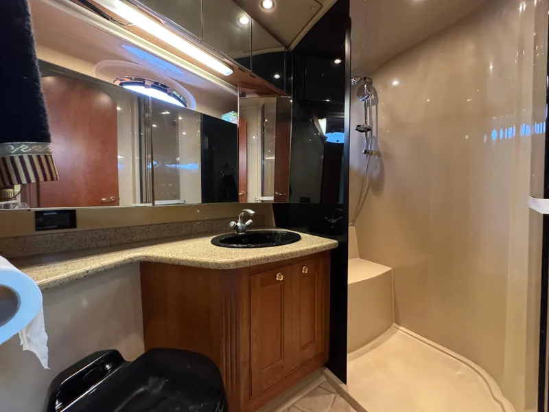 Slide: The Image of Luxurious bathroom in 2003 Cruisers Yachts 5000 Sedan Sport with modern fixtures and shower. - 63