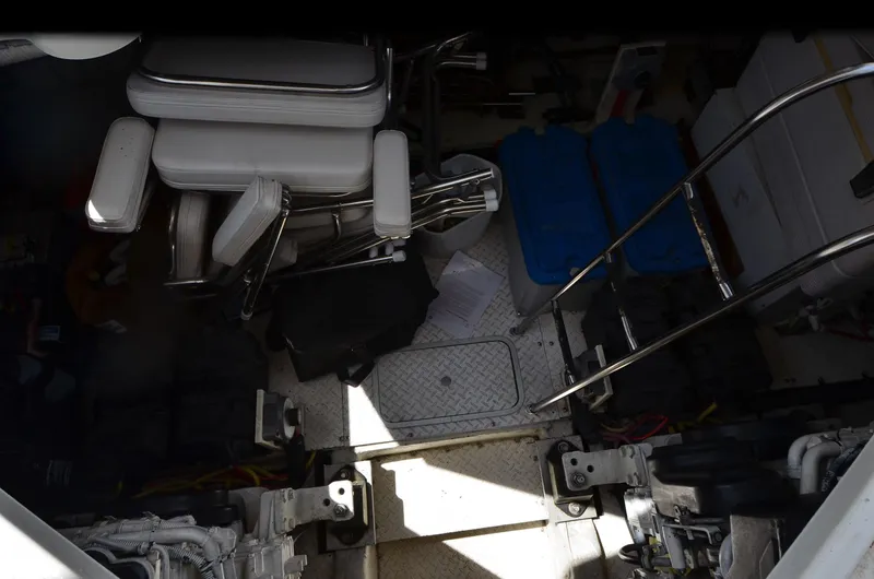 Slide: The Image of Engine room of 2003 Cruisers Yachts 5000 Sedan Sport with equipment and storage items. - 86