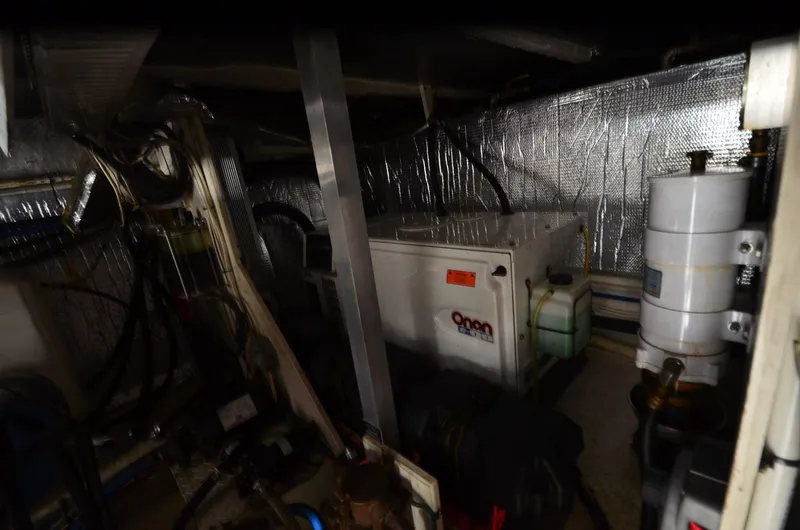 Slide: The Image of Engine room of 2003 Cruisers Yachts 5000 Sedan Sport with Onan generator. - 87