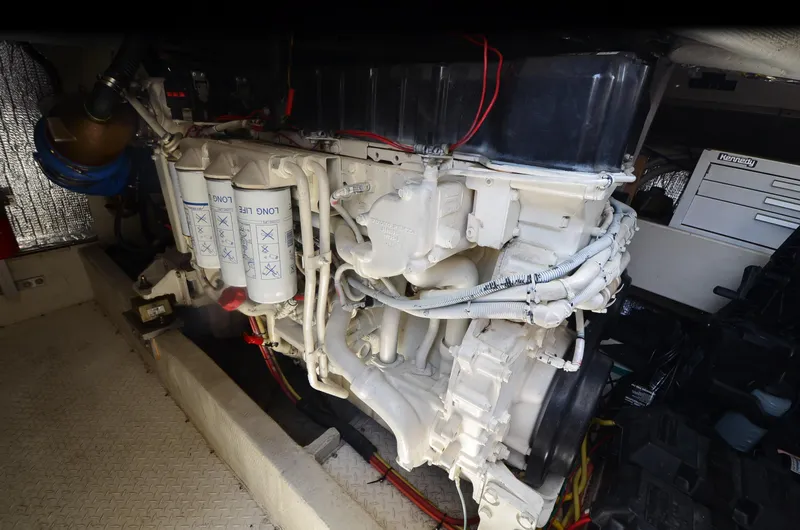 Slide: The Image of Engine room of 2003 Cruisers Yachts 5000 Sedan Sport with visible filters and wiring. - 89