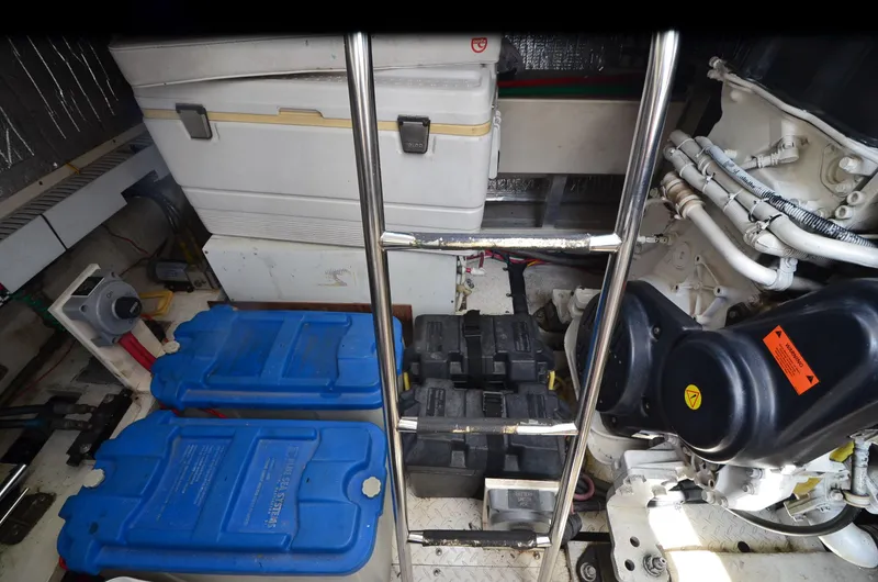Slide: The Image of Engine room of 2003 Cruisers Yachts 5000 Sedan Sport with batteries and equipment. - 90