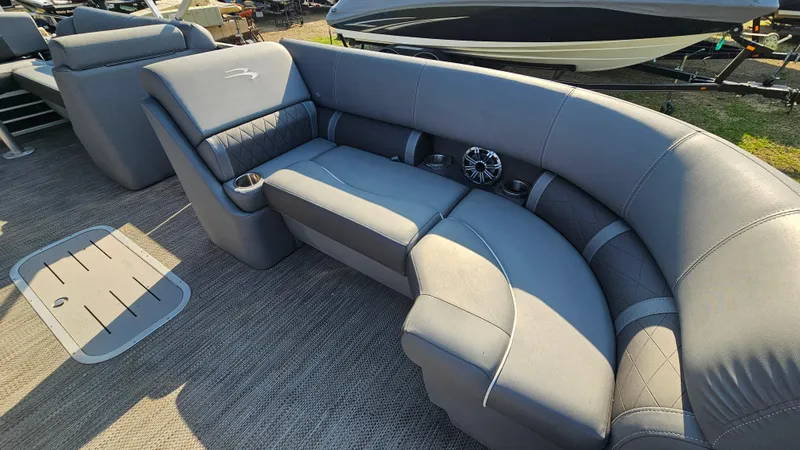 Slide: The Image of 2020 Bennington SX 23 Premium Swingback boat interior with gray seating and speaker system. - 17