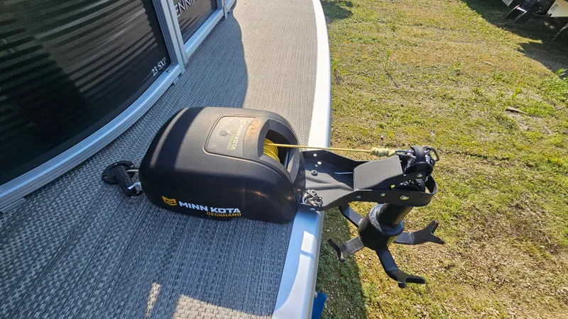 Slide: The Image of 2020 Bennington SX 23 Premium Swingback with Minn Kota trolling motor on deck. - 19
