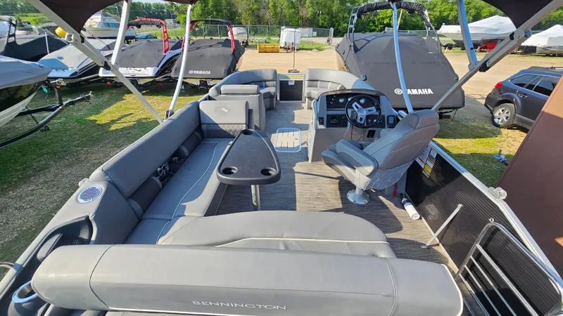 Slide: The Image of 2020 Bennington SX 23 Premium Swingback pontoon boat interior with seating and helm. - 6