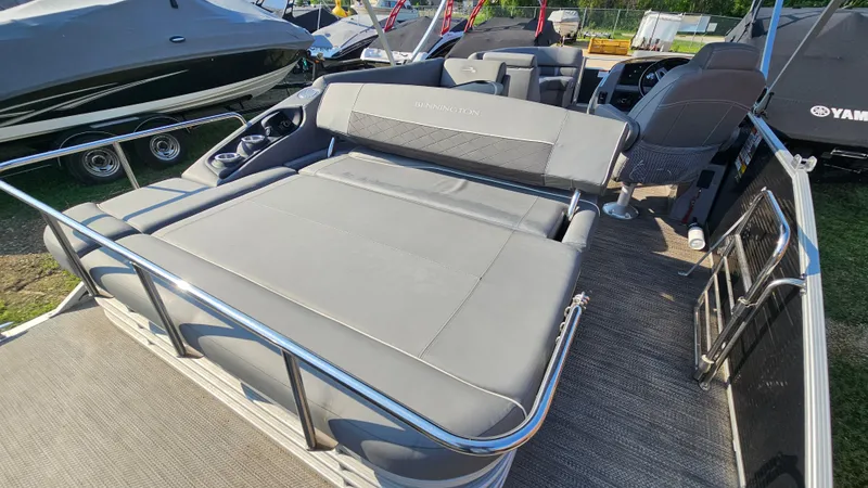 Slide: The Image of 2020 Bennington SX 23 Premium Swingback boat with spacious seating and sleek design. - 7