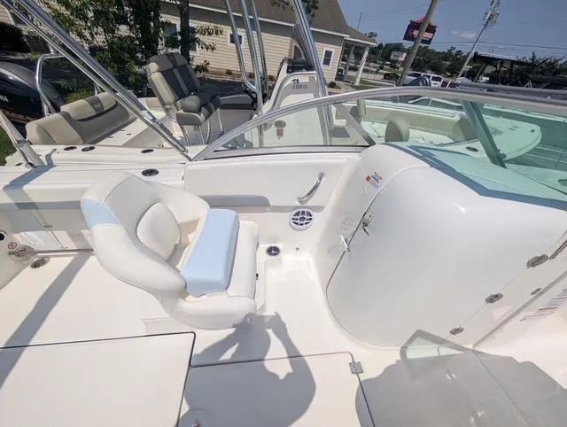 Slide: The Image of 2025 Robalo R207 Dual Console boat interior with seating and console view. - 10