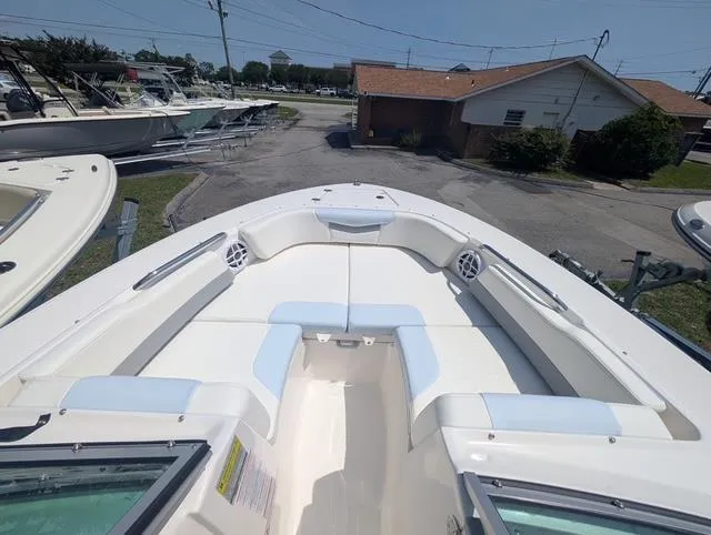 Slide: The Image of 2025 Robalo R207 Dual Console boat with spacious seating and sleek design. - 7