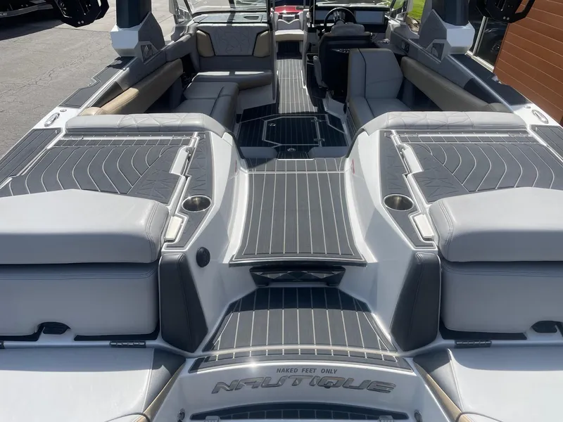 Slide: The Image of 2021 Nautique Super Air Nautique G25 Paragon interior, featuring luxurious seating and sleek design. - 4