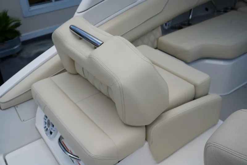 Slide: The Image of Luxurious beige seating on 2023 Regal LX4 boat, featuring sleek design and premium materials. - 10