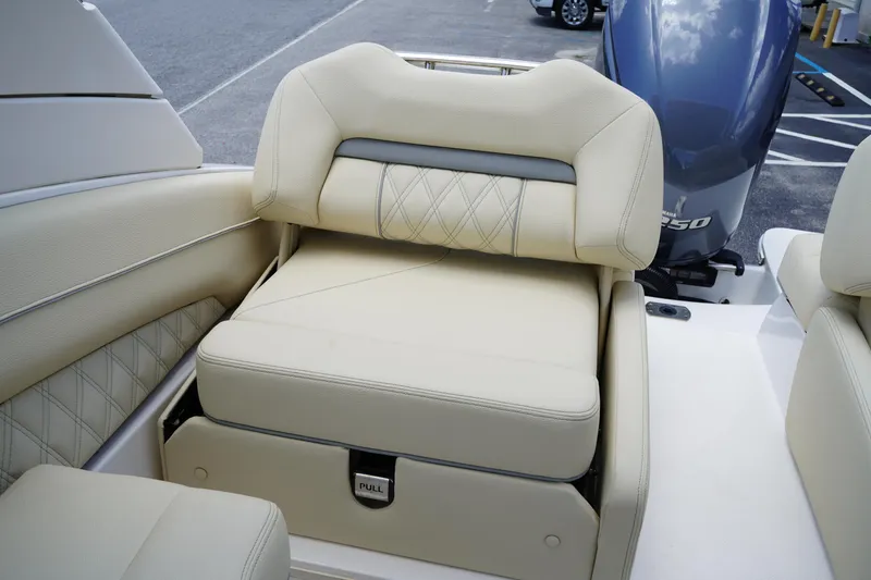 Slide: The Image of 2023 Regal LX4 boat seat with beige upholstery and diamond stitching. - 11