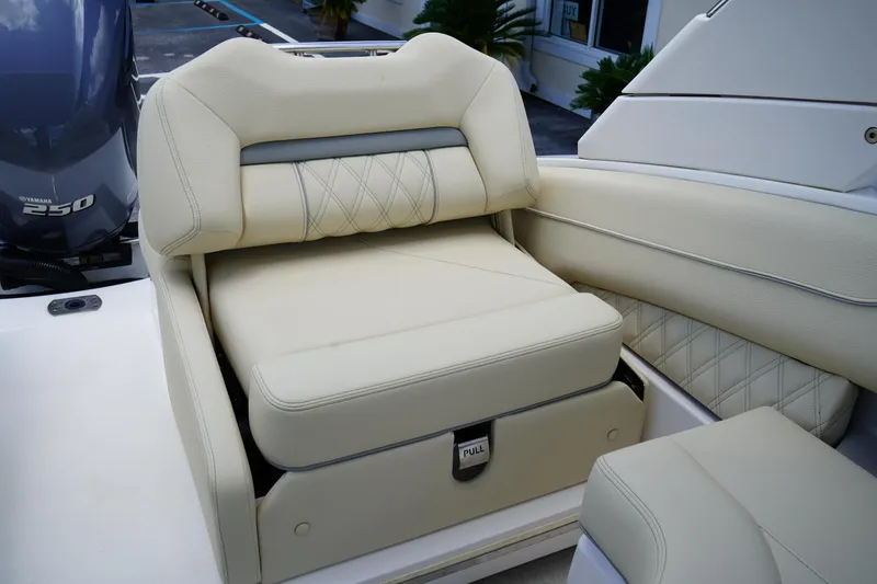 Slide: The Image of 2023 Regal LX4 boat seat with beige upholstery and diamond stitching. - 12