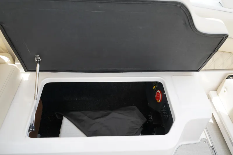 Slide: The Image of Open storage compartment in 2023 Regal LX4 boat. - 18