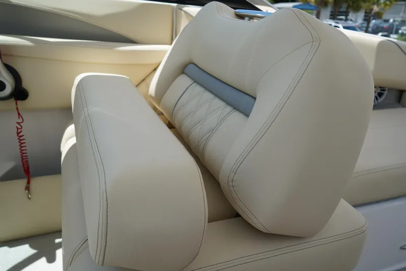 Slide: The Image of 2023 Regal LX4 boat interior with beige leather seating and modern design. - 21