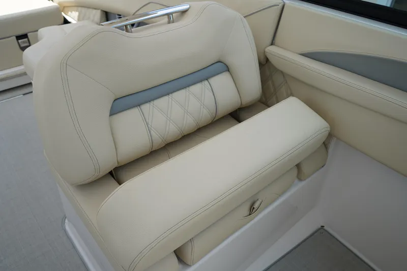 Slide: The Image of 2023 Regal LX4 boat seat with beige upholstery and diamond stitching. - 25