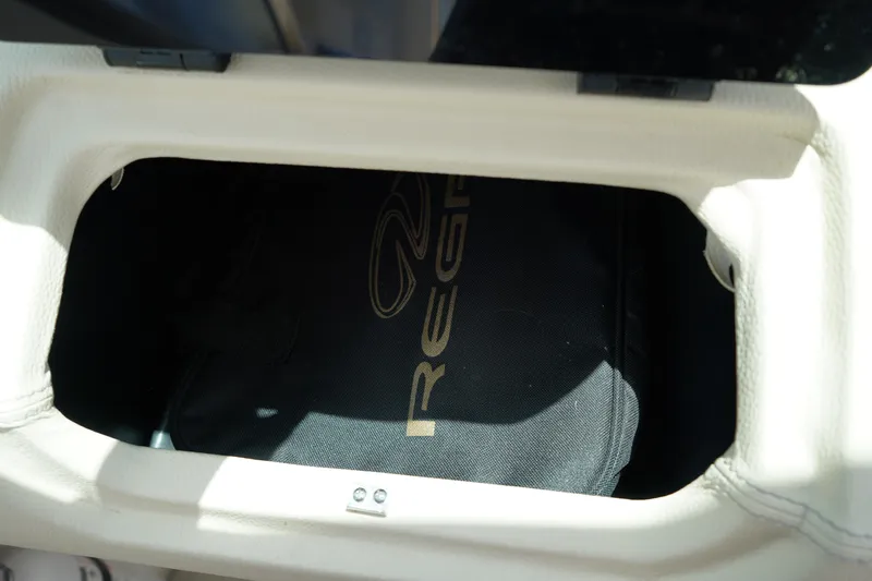 Slide: The Image of 2023 Regal LX4 storage compartment with branded bag inside. - 28