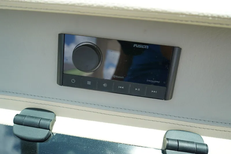 Slide: The Image of 2023 Regal LX4 boat stereo system with Bluetooth connectivity and control panel. - 29