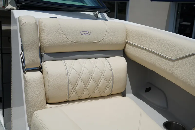 Slide: The Image of Luxurious seating in the 2023 Regal LX4 boat, featuring elegant beige upholstery. - 33