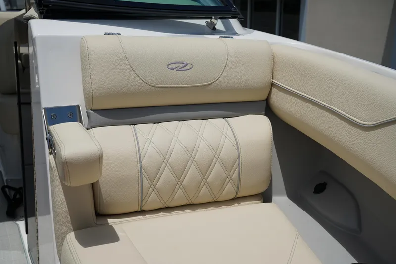 Slide: The Image of Luxurious seating in 2023 Regal LX4 boat with beige upholstery and diamond stitching. - 34