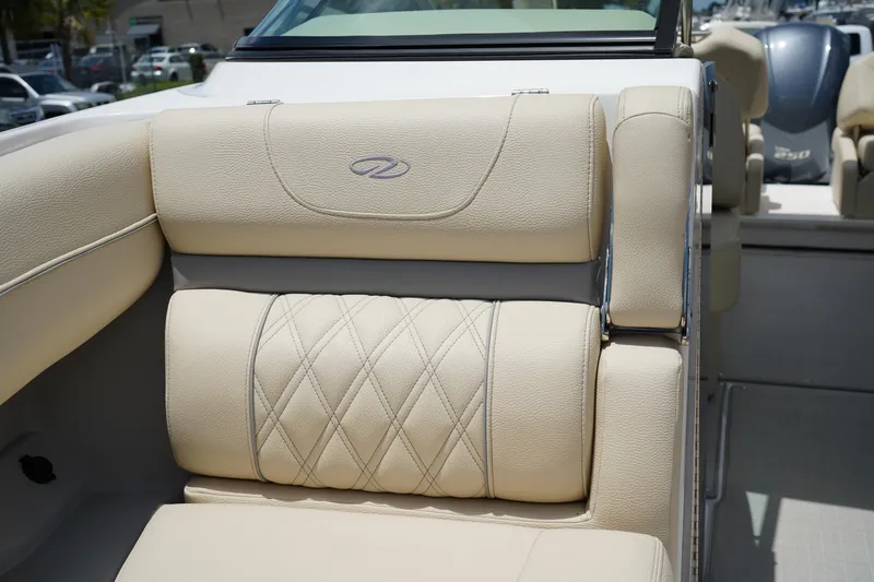Slide: The Image of Luxurious beige seating on 2023 Regal LX4 boat, featuring diamond stitching and elegant design. - 35