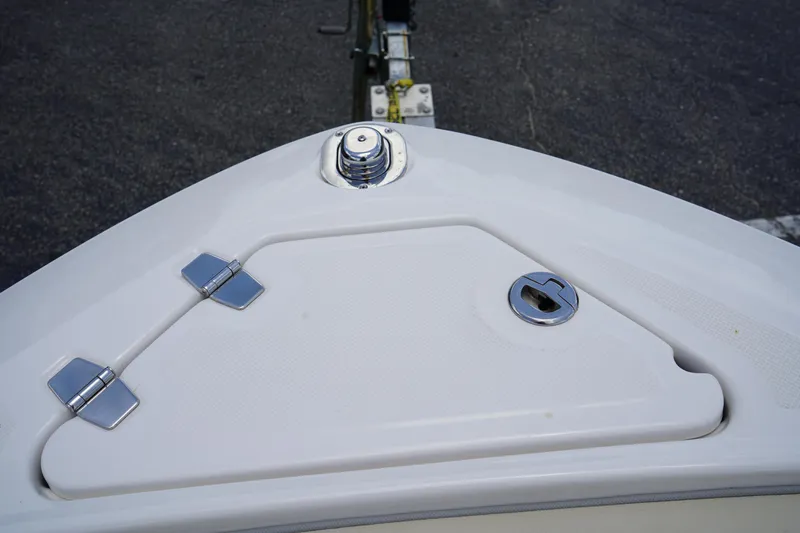 Slide: The Image of 2023 Regal LX4 boat bow with hatch and chrome fittings. - 42