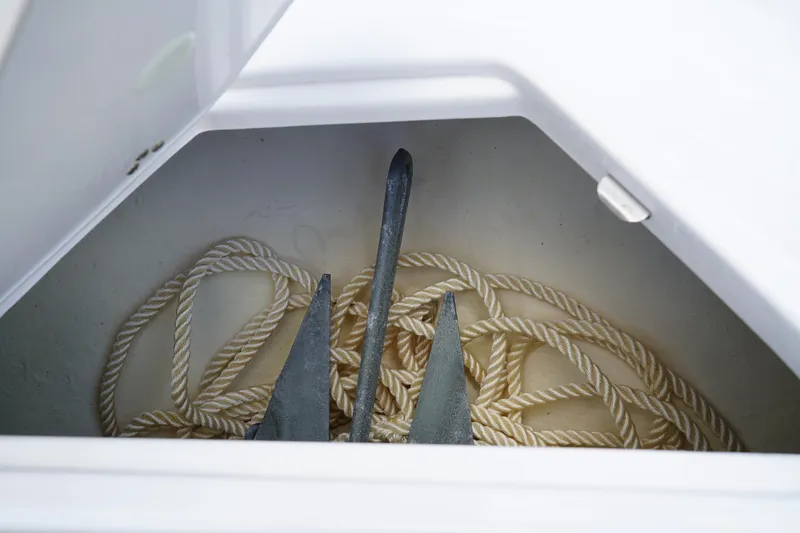 Slide: The Image of Anchor and rope storage in 2023 Regal LX4 boat compartment. - 43
