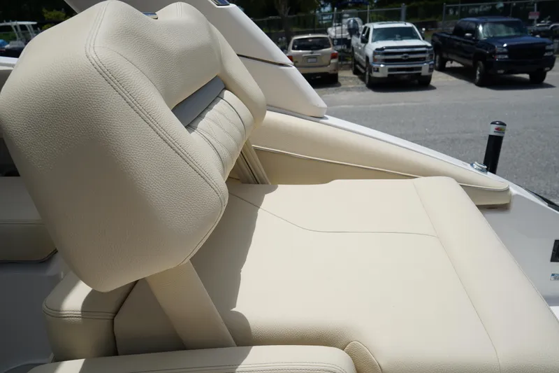 Slide: The Image of 2023 Regal LX4 boat with beige leather seating, showcasing luxurious design and comfort. - 8