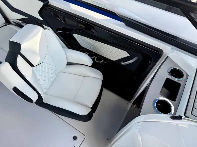 Slide: The Image of 2025 Yamaha Boats 252SD interior with white seating and modern design elements. - 11