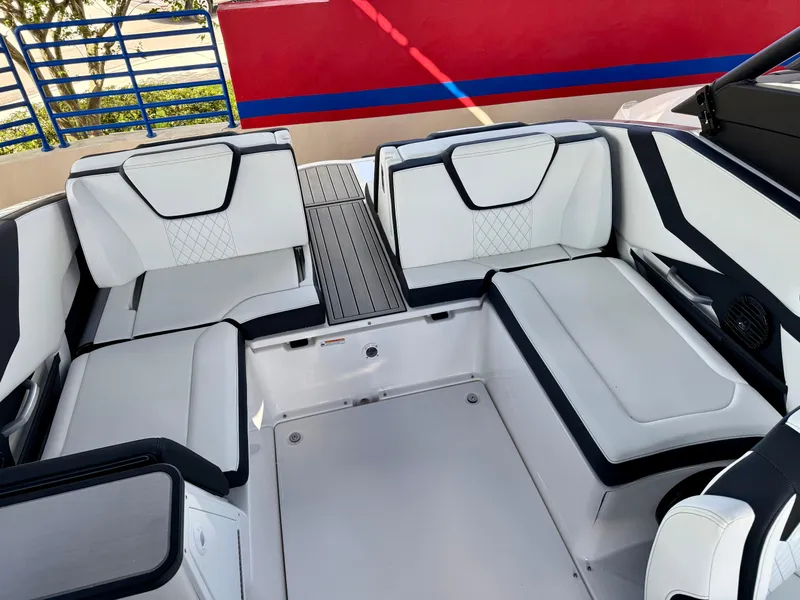 Slide: The Image of 2025 Yamaha Boats 252SD interior with modern seating and sleek design. - 12