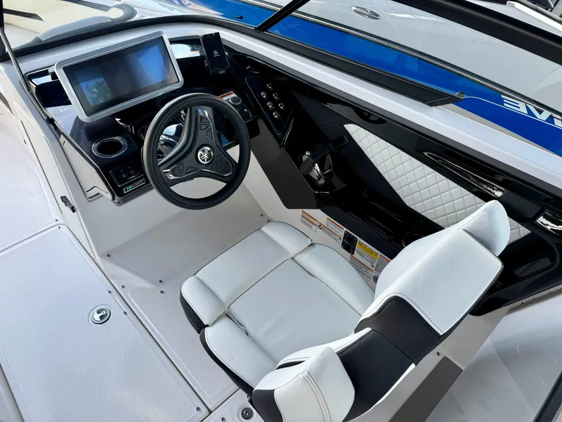 Slide: The Image of 2025 Yamaha Boats 252SD cockpit with modern steering and touchscreen display. - 9