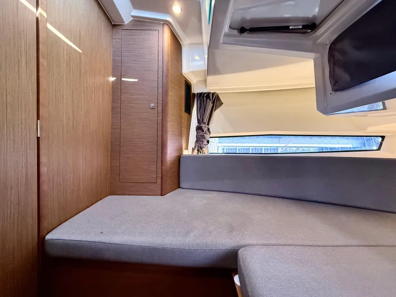 Slide: The Image of Interior cabin of 2020 Jeanneau NC Sport 895 with modern wood finish and seating. - 27