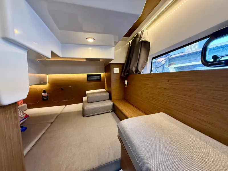 Slide: The Image of Interior of 2020 Jeanneau NC Sport 895 boat, featuring cozy seating and modern design. - 30