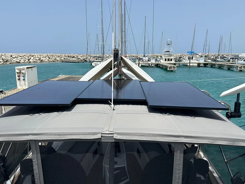 Slide: The Image of Beneteau Oceanis 50 sailboat with solar panels, docked in a marina, 2014 model. - 13
