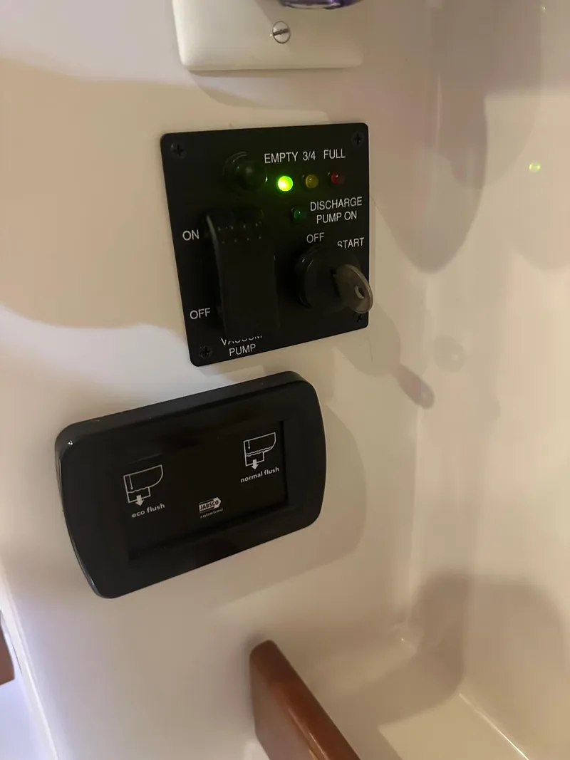 Slide: The Image of Control panel on a 2014 Beneteau Oceanis 50 yacht, showing pump and tank indicators. - 20