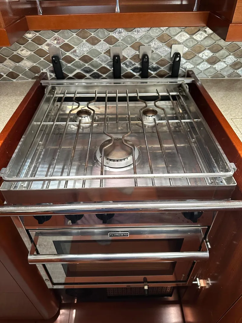 Slide: The Image of Stainless steel stove in 2014 Beneteau Oceanis 50 yacht kitchen with tiled backsplash. - 21