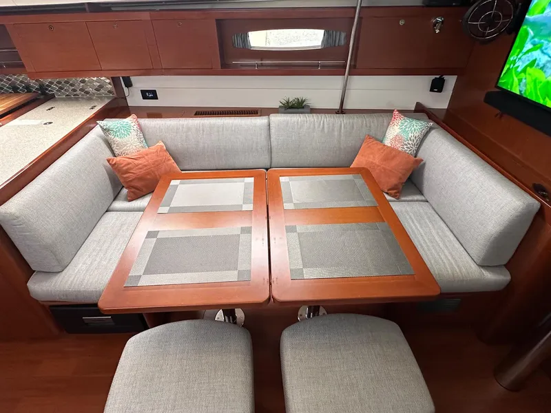 Slide: The Image of Luxurious interior of 2014 Beneteau Oceanis 50 yacht with elegant seating and dining area. - 22