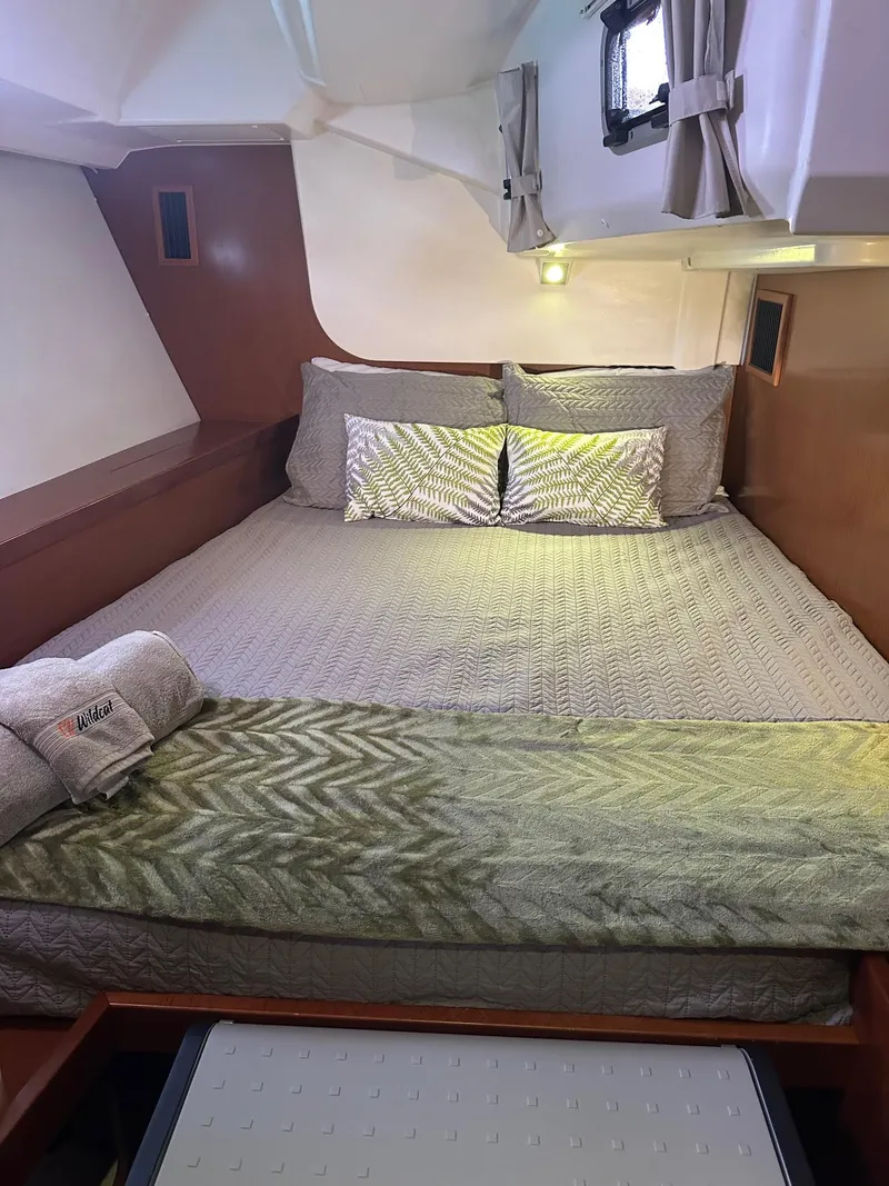 Slide: The Image of Cozy cabin interior of 2014 Beneteau Oceanis 50 yacht with neatly arranged bedding. - 26