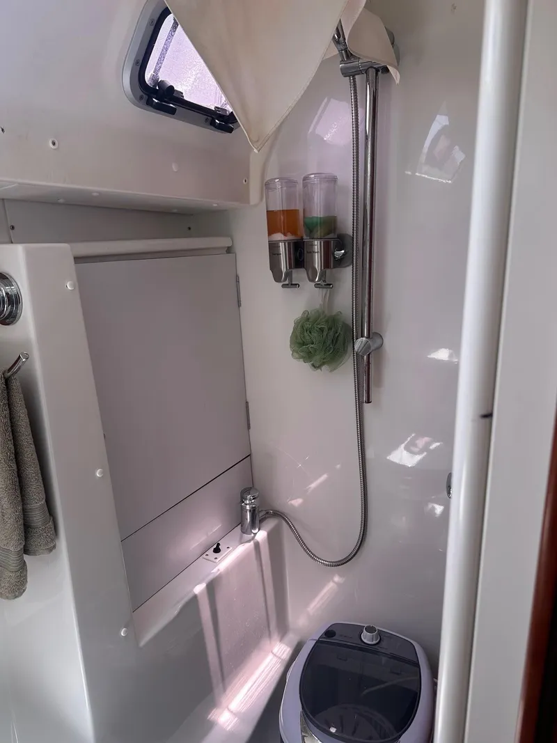 Slide: The Image of Beneteau Oceanis 50 yacht bathroom with shower, dispensers, and compact design, 2014 model. - 31