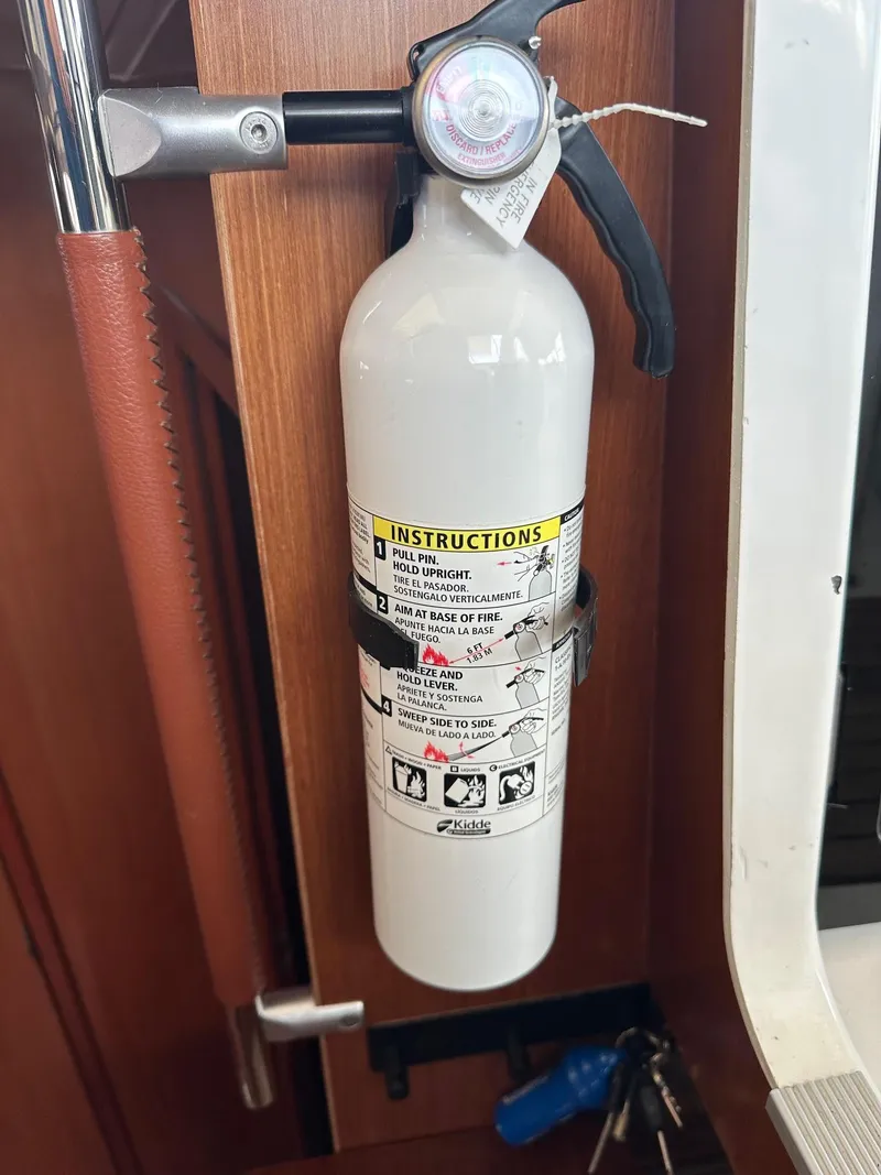 Slide: The Image of Fire extinguisher mounted on 2014 Beneteau Oceanis 50 yacht interior. - 36