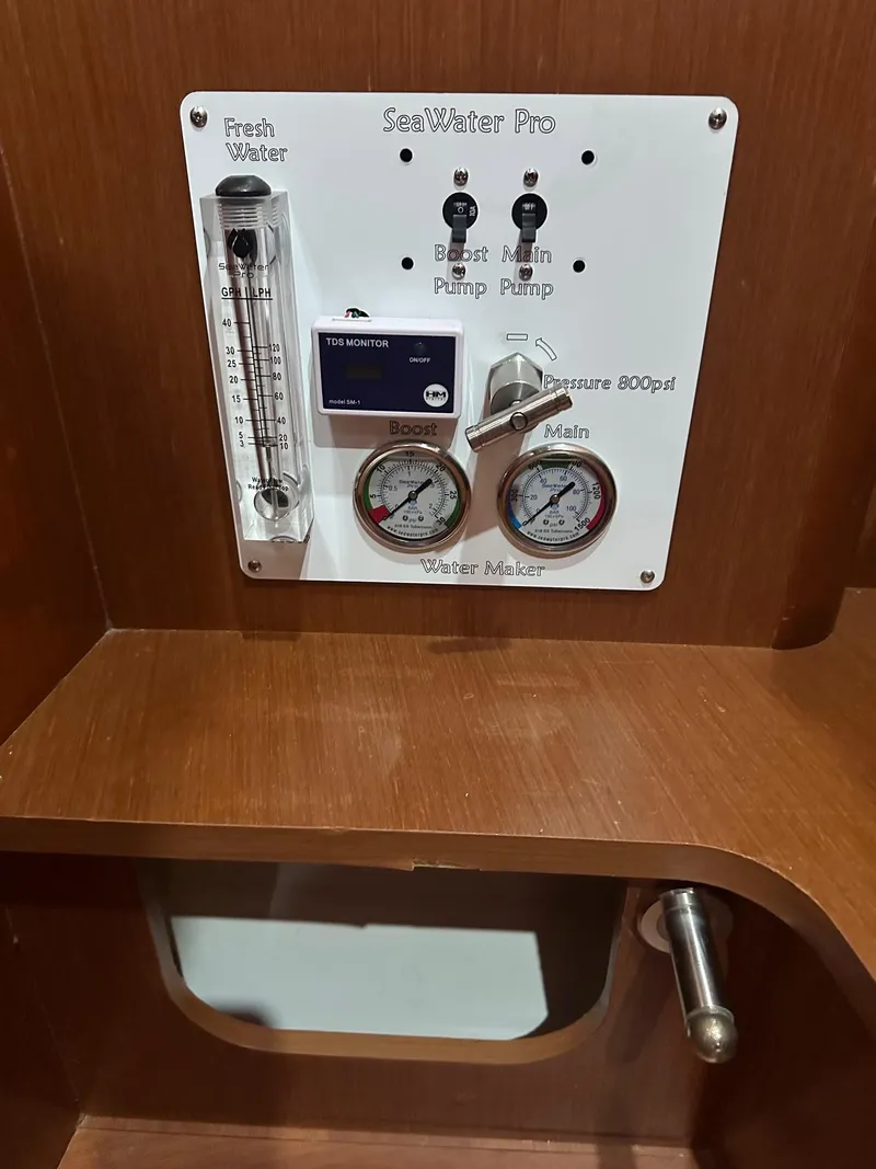 Slide: The Image of Control panel on 2014 Beneteau Oceanis 50 yacht, featuring gauges and switches. - 38