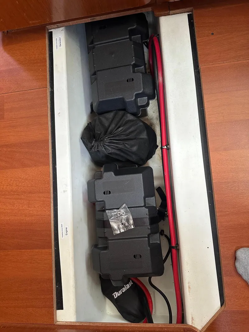 Slide: The Image of Battery compartment of a 2014 Beneteau Oceanis 50 sailboat with red cables. - 52