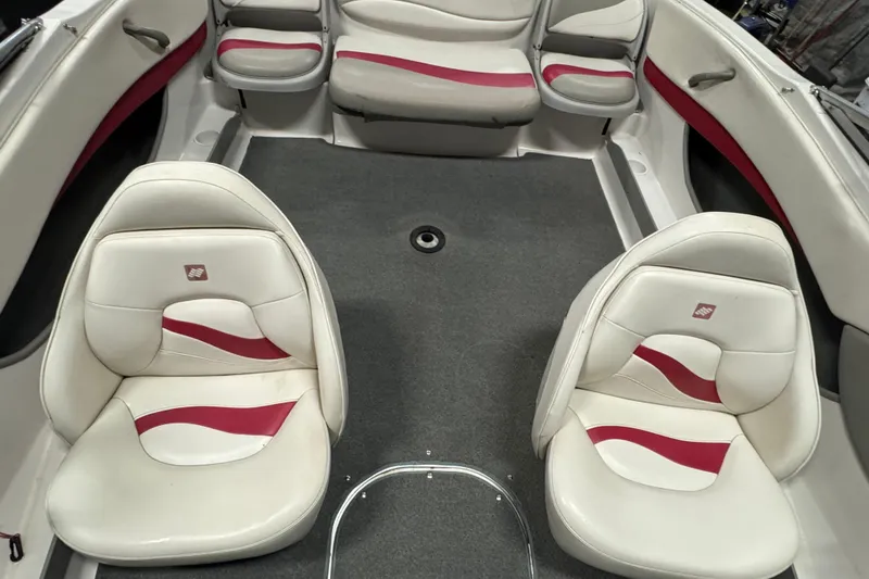 Slide: The Image of Interior of 2000 Four Winns 180 Horizon boat with white and red seating. - 16